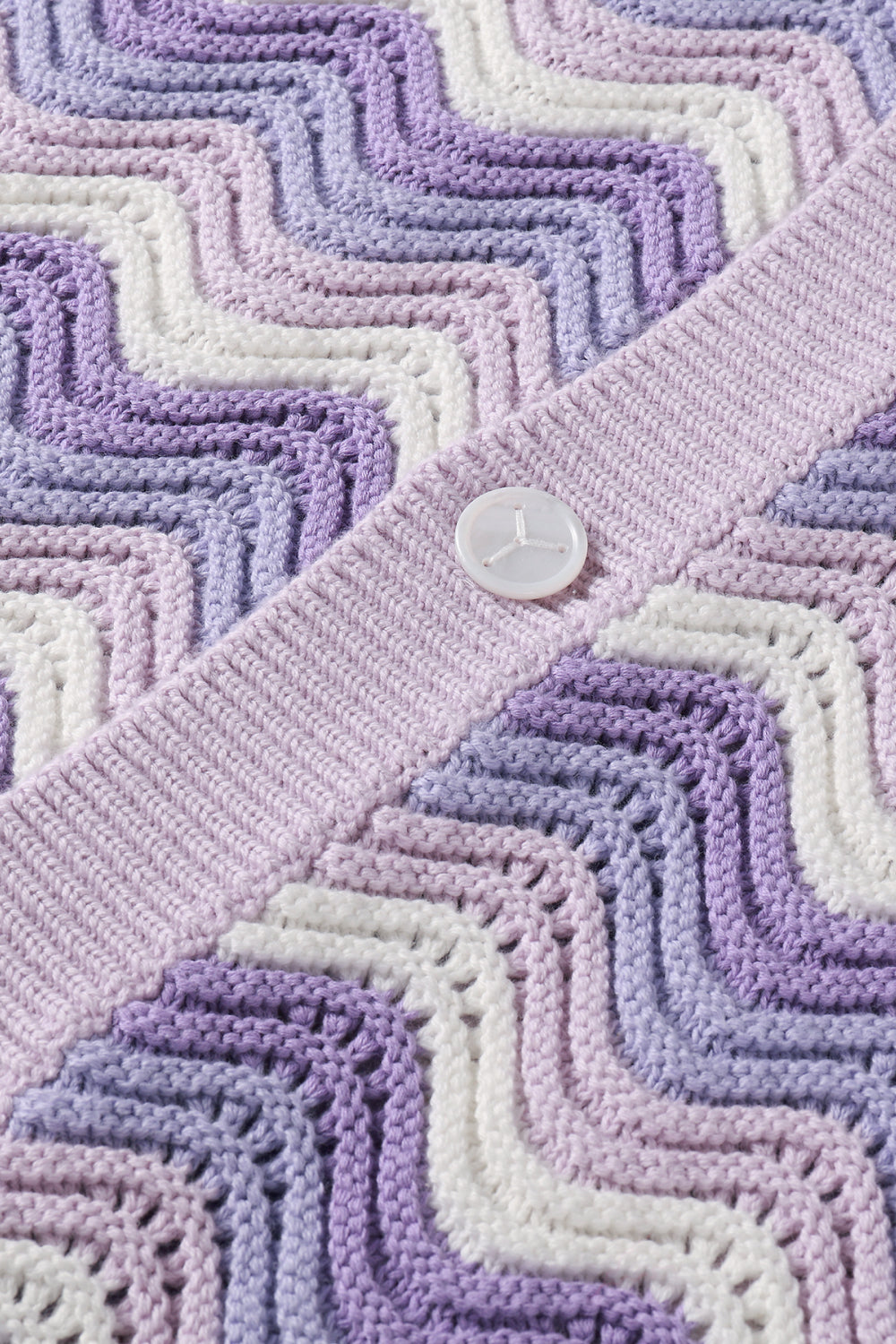 Close-up of the shale stitch knit showing layered shades of lavender, lilac, and white.
