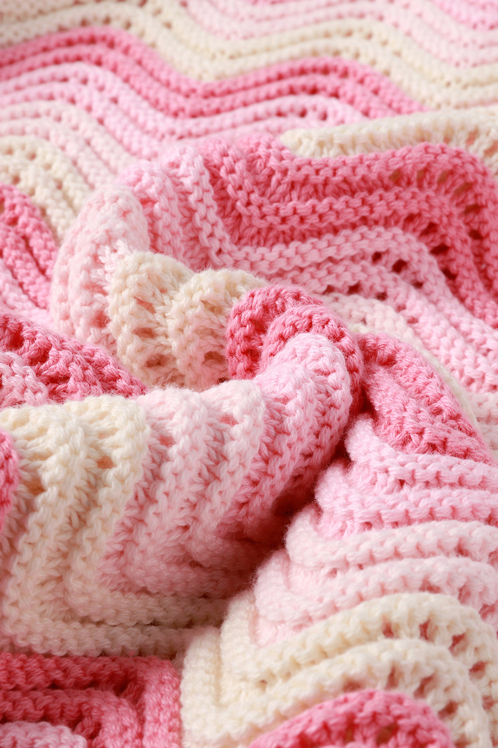 Close-up of a pink and white knit shirt