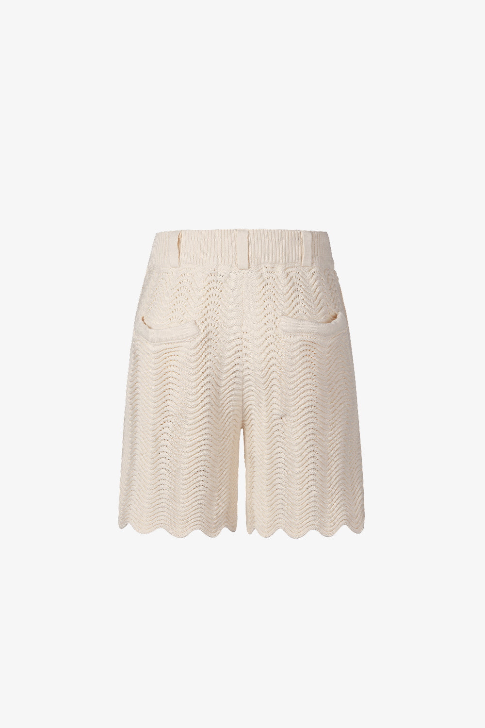 Back view of ivory shale stitch knit shorts with scalloped hem.