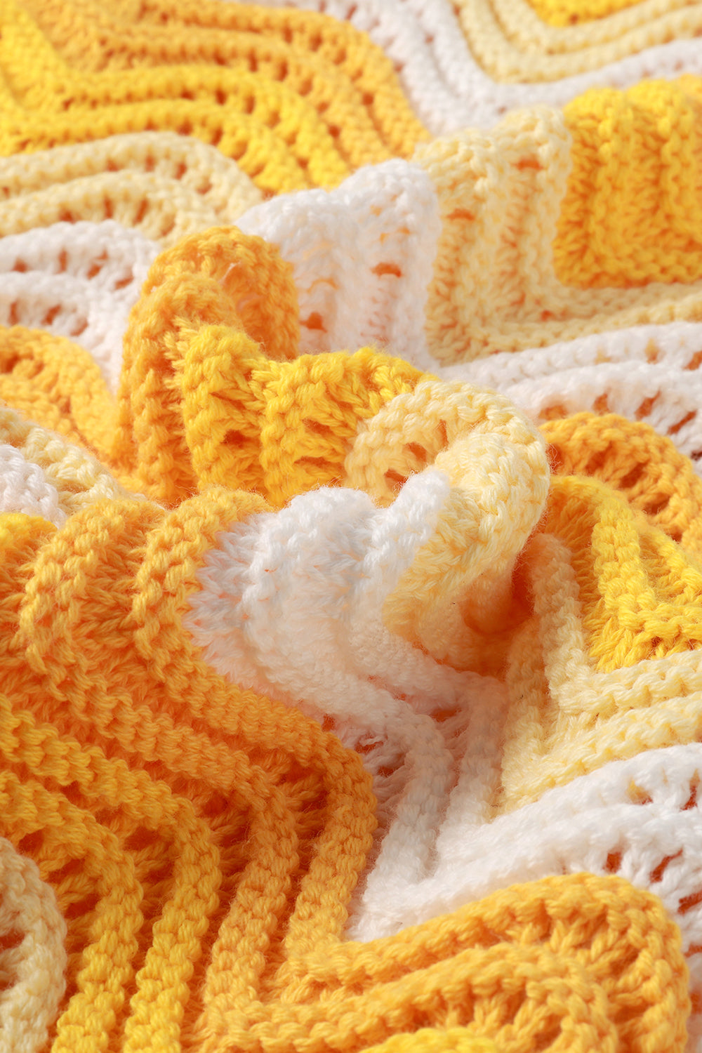 Close-up of a textured yellow and white fabric pattern