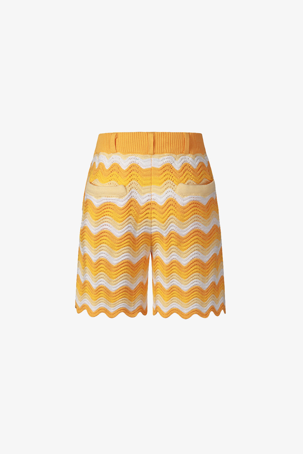 Back view of yellow and white shale stitch knit shorts with scalloped hem.