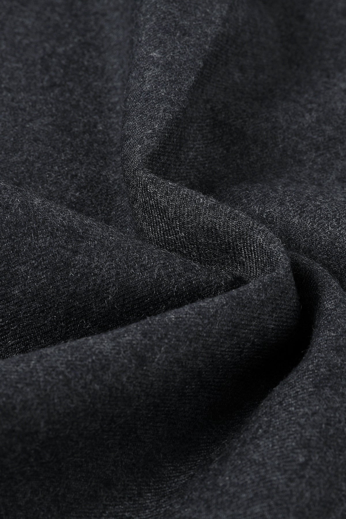 Close-up of charcoal wool fabric texture.