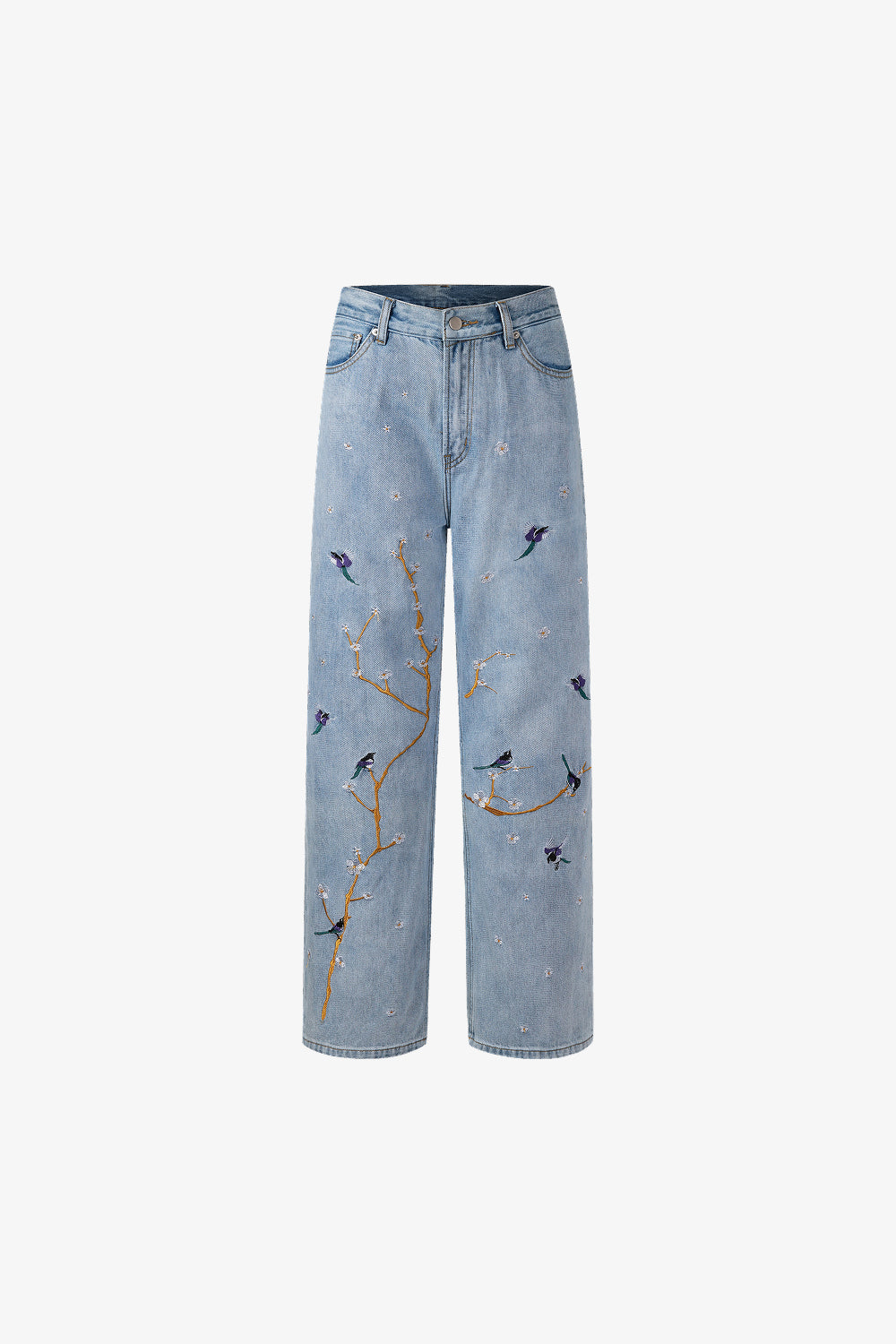 Light blue jeans with bird and branch embroidery on a white background