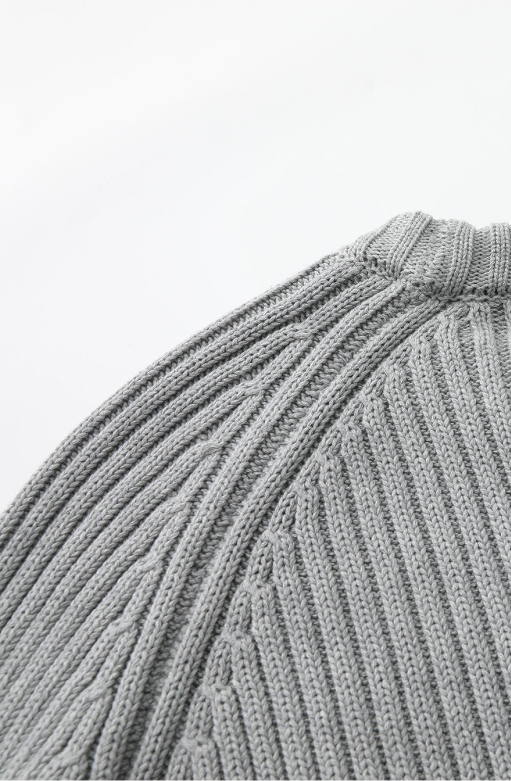 Close-up of a ribbed gray knitted fabric on a white background