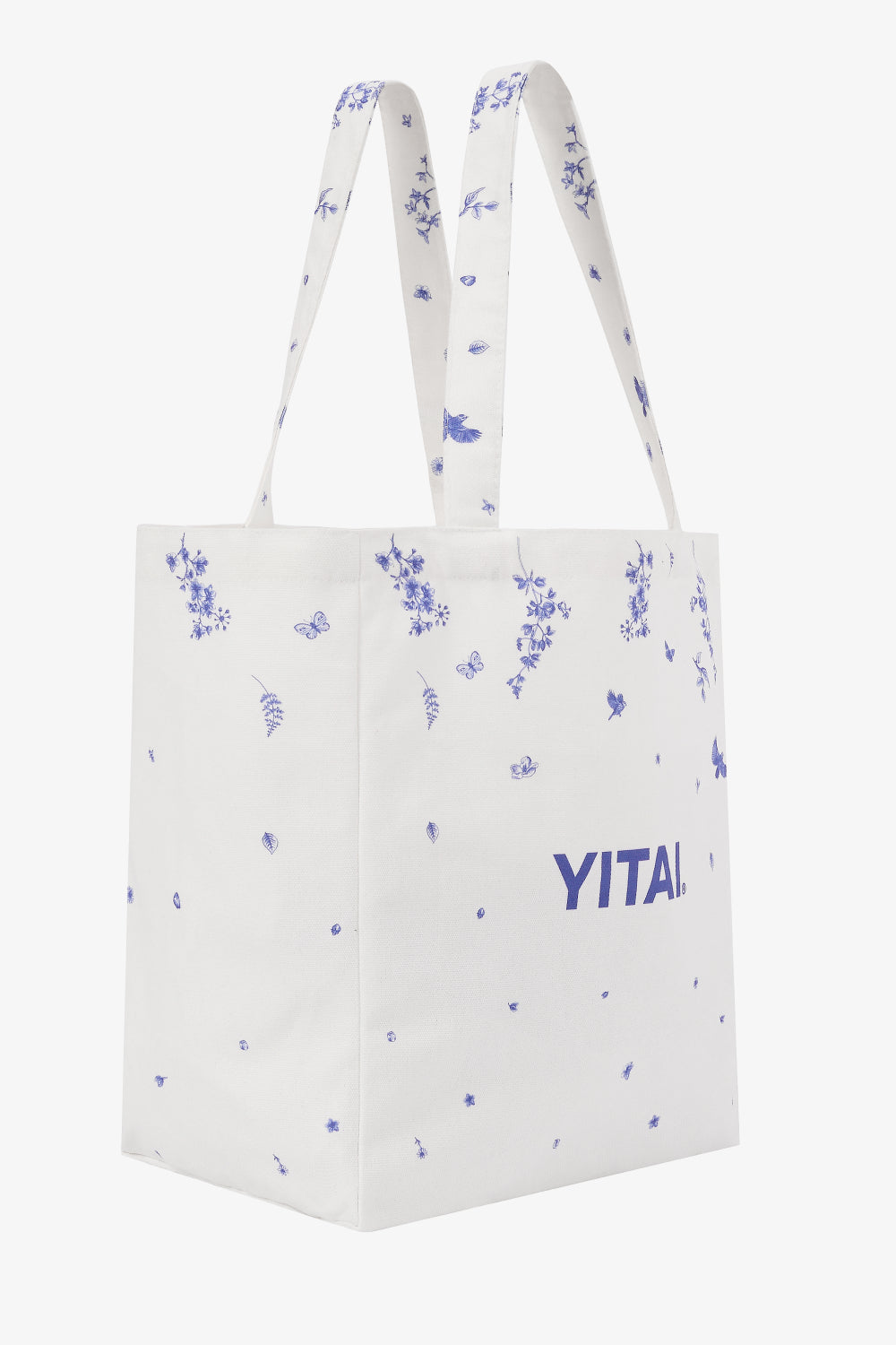 White tote bag with blue floral patterns and 'YITAI' branding on a white background