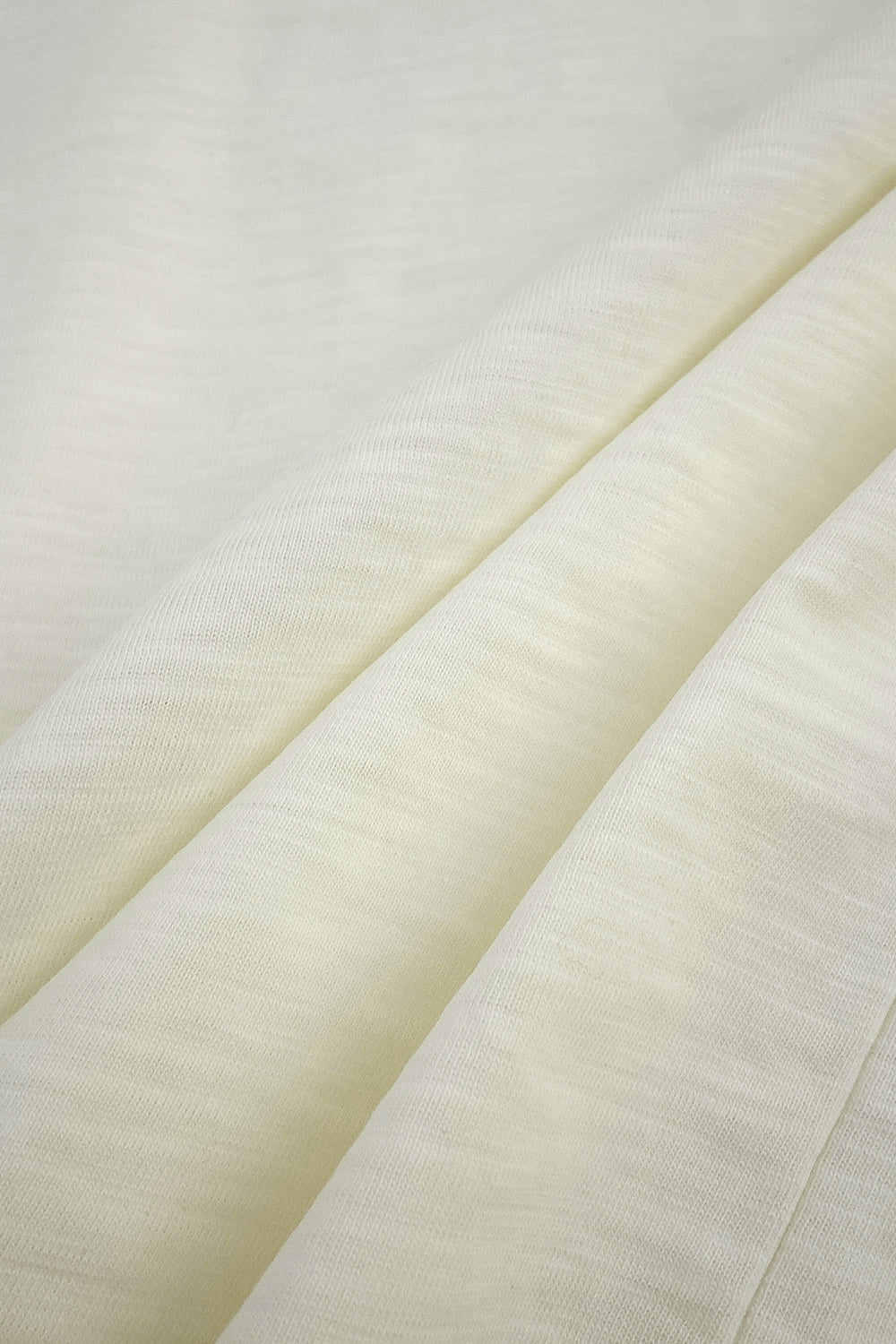 Close-up of a cream fabric.