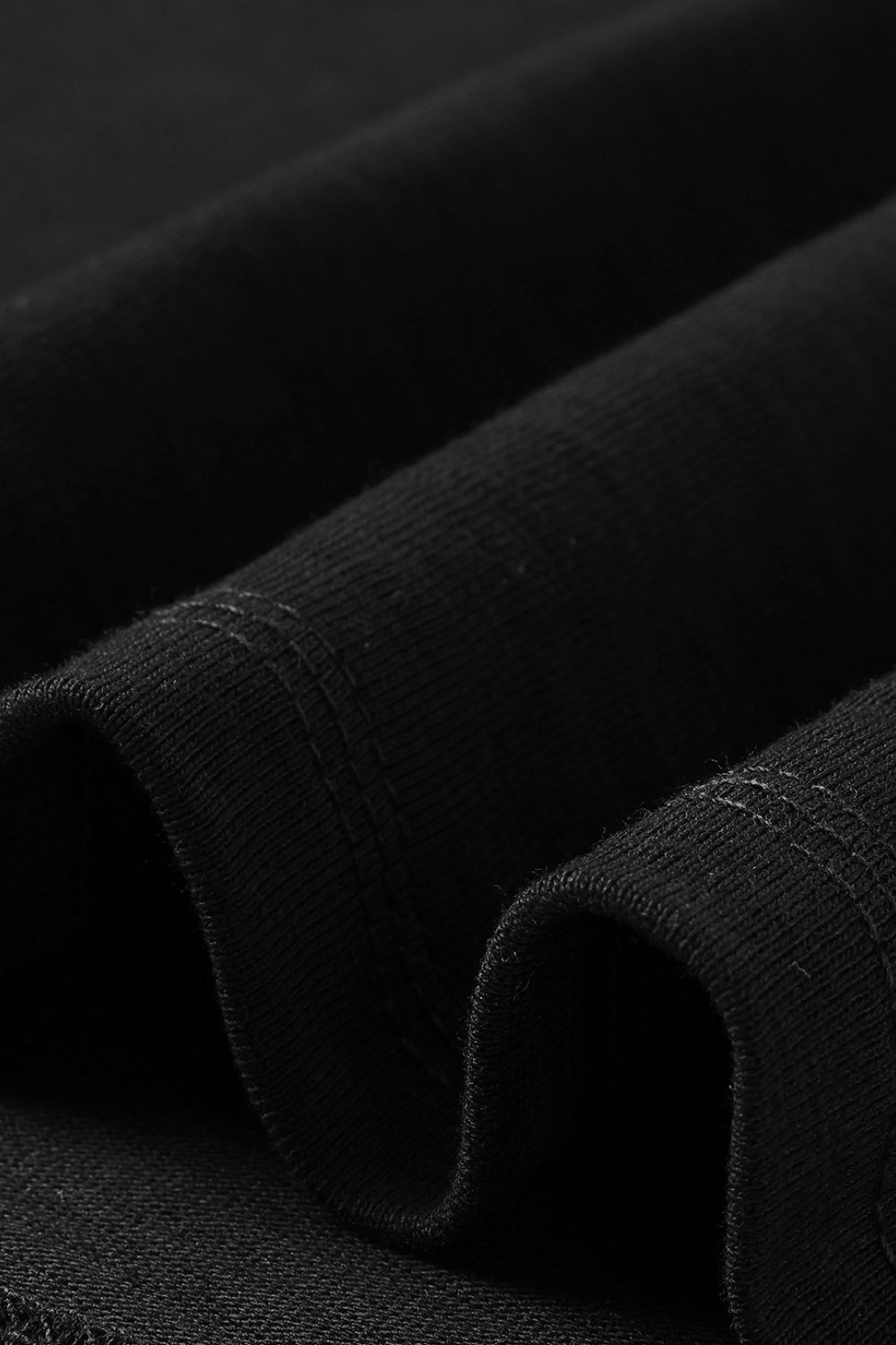 Close-up of the black tee's fabric.