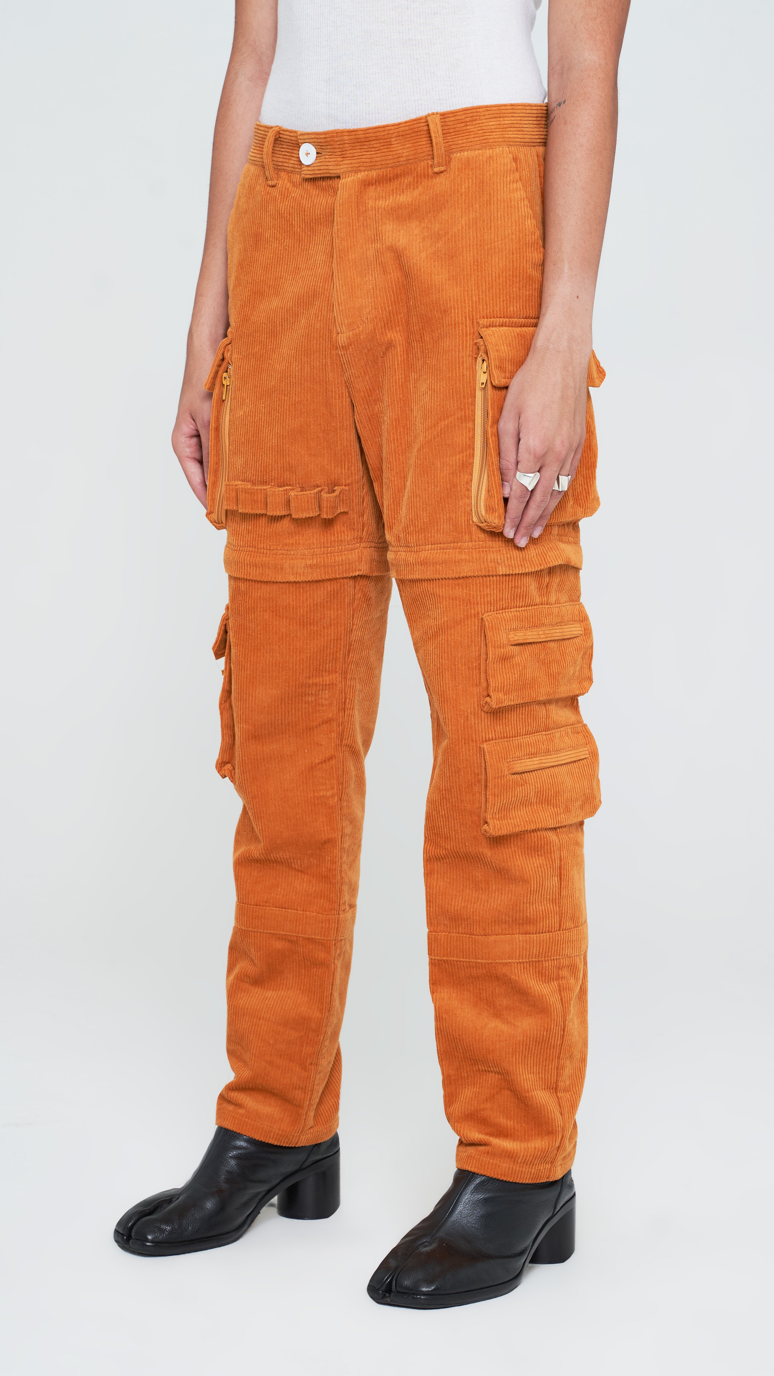 Upgraded with an improved corduroy fabric in apricot brown and better sizing. These pants are adaptable for year-round wear, these utility pants are built from a functional corduroy fabric with fair stretch. Its construction is secured with stitched panels and it's made with plenty of utilitarian appeal with multiple pockets. These trousers are competent for any season as it's zipper-adjustable and can be transformed into a pair of shorts when the temperature rises.