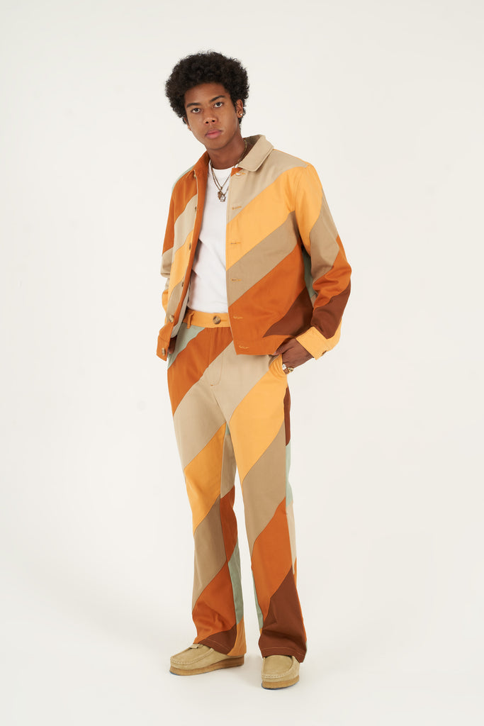 Bringing a touch of fall into your wardrobe, this cotton twill jacket is made using a durable cotton twill. Secured with bone buttons, it has two slit pockets on the sides to storage your everyday essentials. Pair it with our   Diagonal Striped Patchwork Pants to complete your fall and winter look.