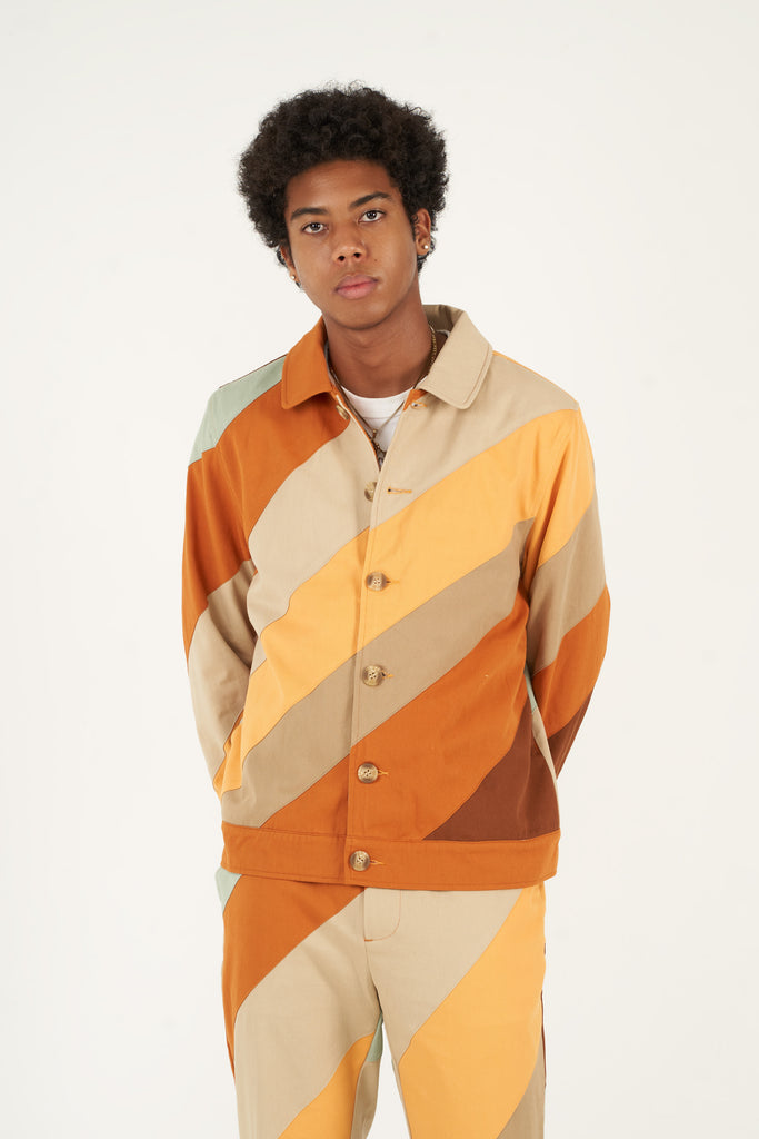 Bringing a touch of fall into your wardrobe, this cotton twill jacket is made using a durable cotton twill. Secured with bone buttons, it has two slit pockets on the sides to storage your everyday essentials. Pair it with our   Diagonal Striped Patchwork Pants to complete your fall and winter look.